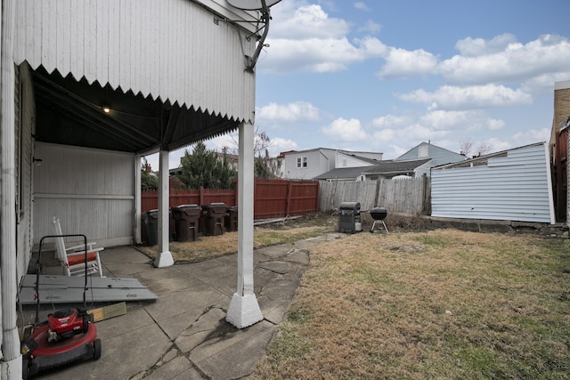 view of yard featuring a patio and fence