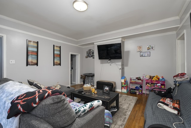 living area with crown molding and wood finished floors