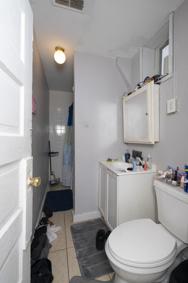 bathroom featuring visible vents, curtained shower, toilet, tile patterned floors, and vanity