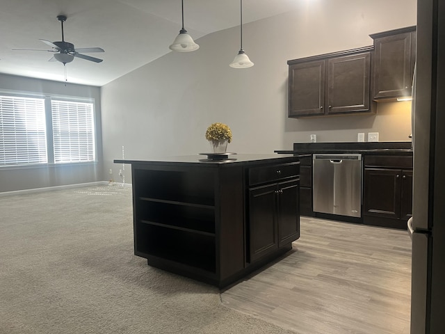 kitchen with a center island, open shelves, dark countertops, lofted ceiling, and appliances with stainless steel finishes