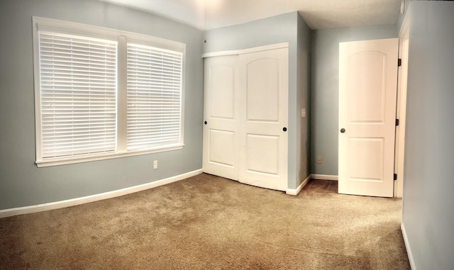 7461 Flintshire Dr, Alexandria, KY 41001 - unfurnished bedroom with a closet, carpet flooring, and baseboards