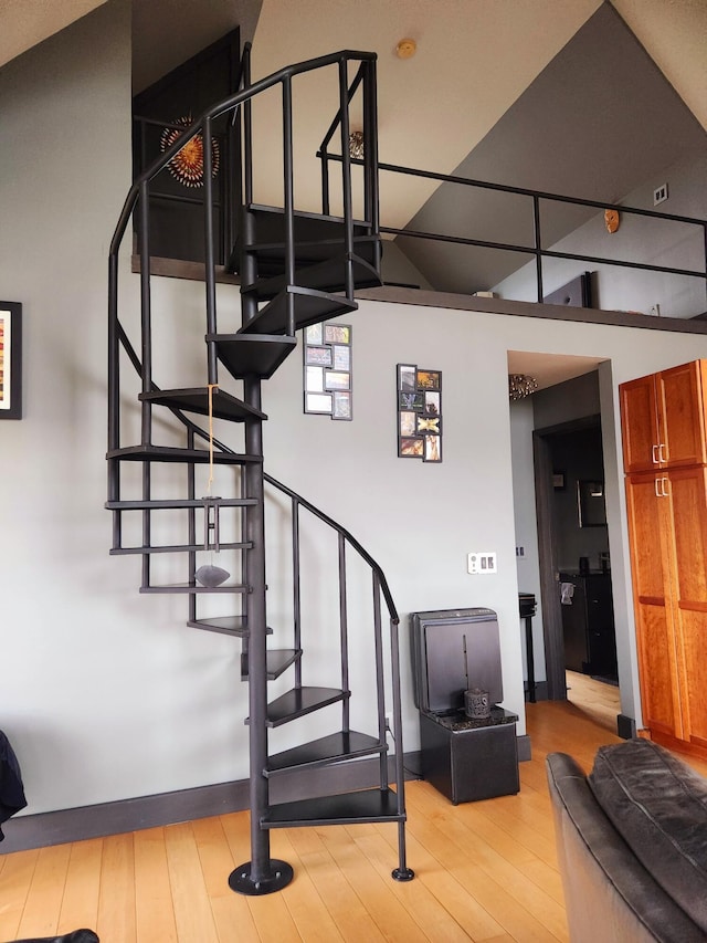 stairs featuring hardwood / wood-style flooring