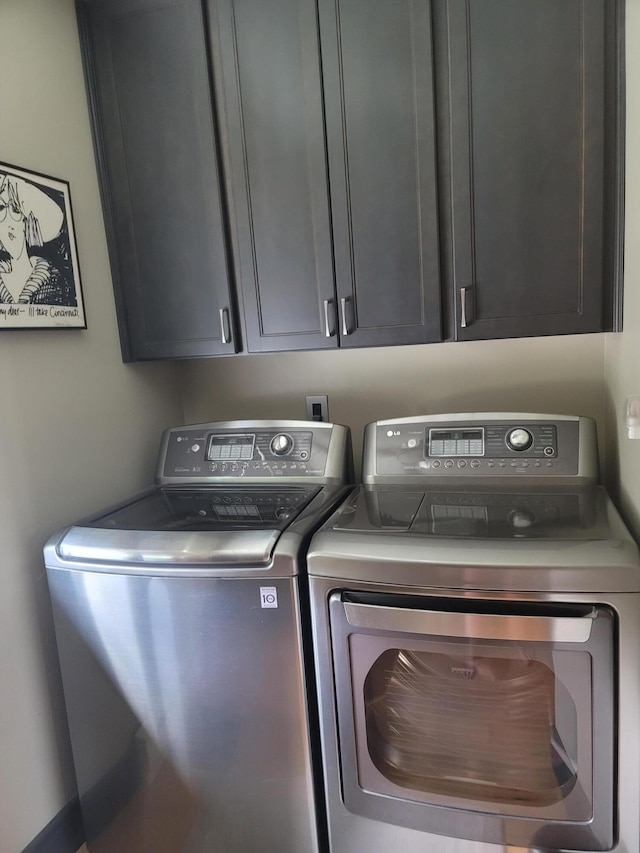 5433 Mary Ingles Hwy, Foster, KY 41043 - laundry area featuring washing machine and clothes dryer and cabinet space