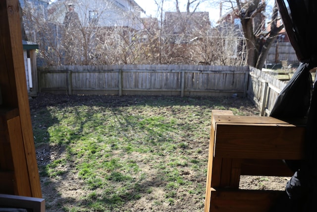 view of yard featuring a fenced backyard