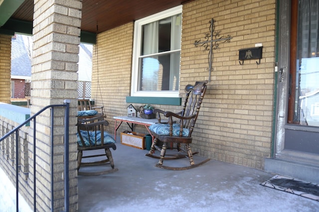 view of patio featuring a balcony