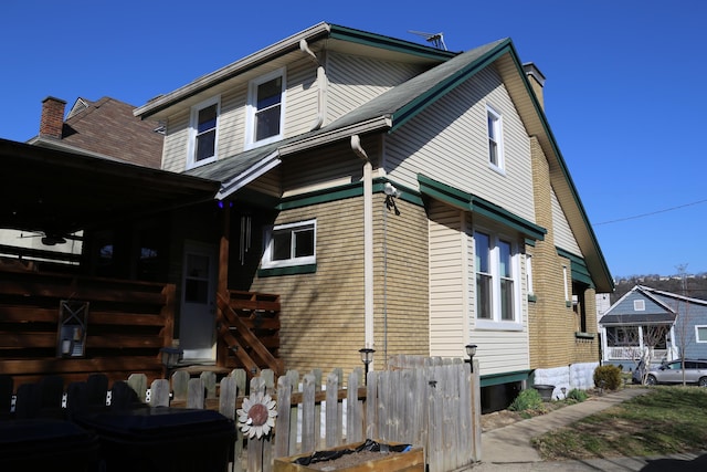 view of home's exterior featuring a chimney