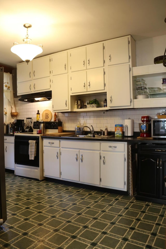 kitchen with open shelves, range with electric cooktop, dark countertops, and under cabinet range hood