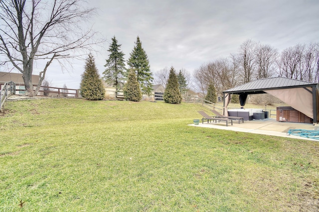 view of yard with a patio, an outdoor living space, a gazebo, and fence