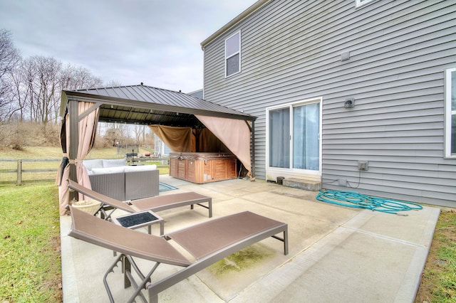 view of patio featuring fence, an outdoor living space, and a gazebo