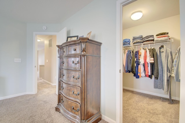 walk in closet with carpet floors and visible vents