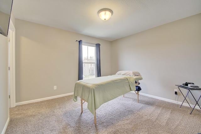 carpeted bedroom featuring baseboards