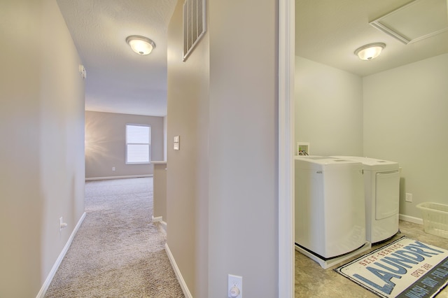 laundry room featuring laundry area, visible vents, baseboards, and separate washer and dryer