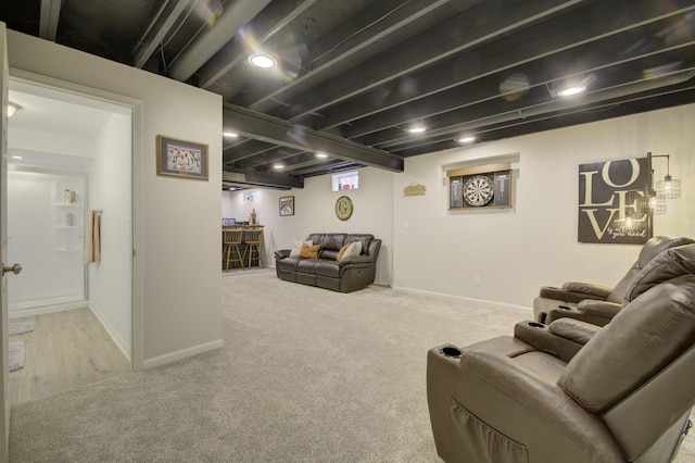 carpeted living room featuring baseboards