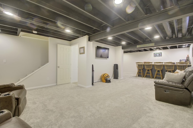 interior space with a bar, stairs, and baseboards