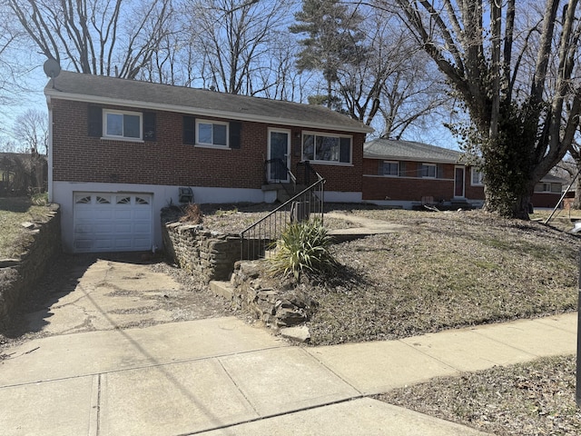 ranch-style house featuring brick siding, an attached garage, and driveway