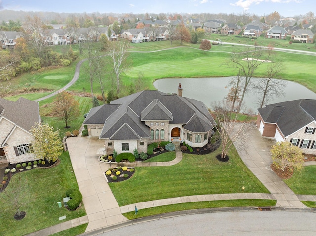 birds eye view of property featuring a residential view and a water view