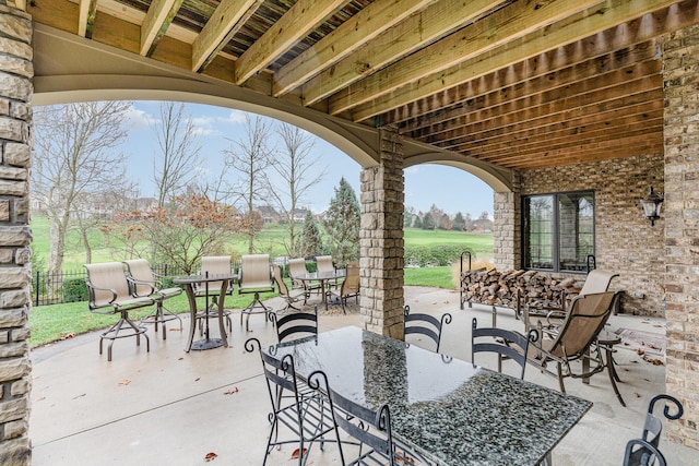 view of patio / terrace featuring outdoor dining area and fence