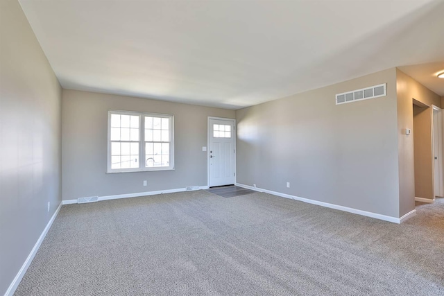 spare room with visible vents and baseboards