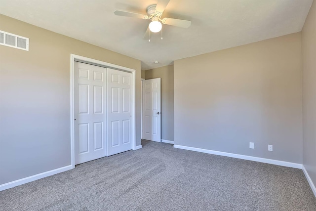 unfurnished bedroom with visible vents, baseboards, and carpet floors