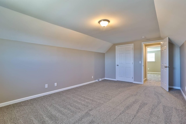 bonus room featuring visible vents, lofted ceiling, baseboards, and carpet floors