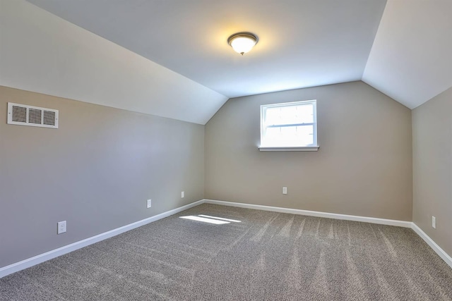 bonus room with visible vents, baseboards, carpet, and lofted ceiling