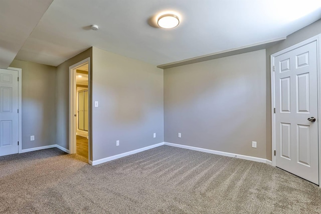 unfurnished bedroom with baseboards and carpet flooring