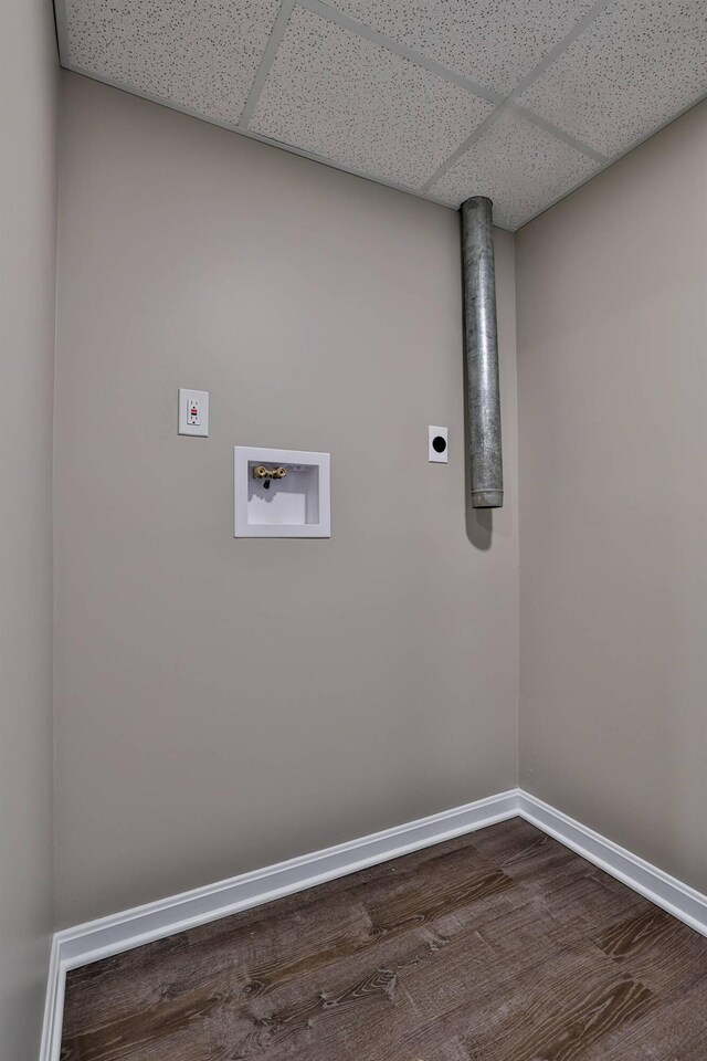 laundry room with dark wood-style flooring, baseboards, hookup for an electric dryer, hookup for a washing machine, and laundry area