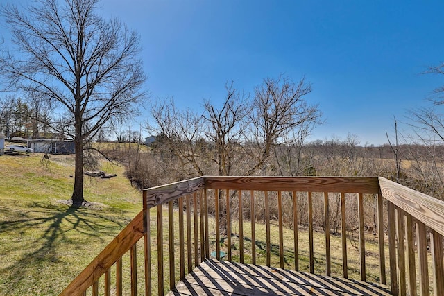 wooden terrace with a yard