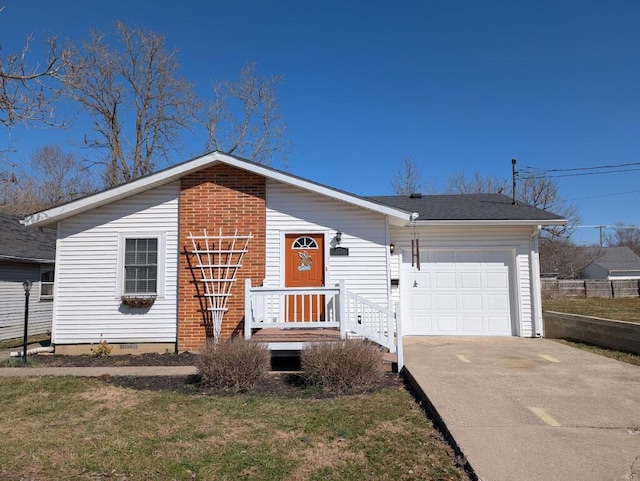 view of front facade with a garage, a front lawn, concrete driveway, crawl space, and brick siding