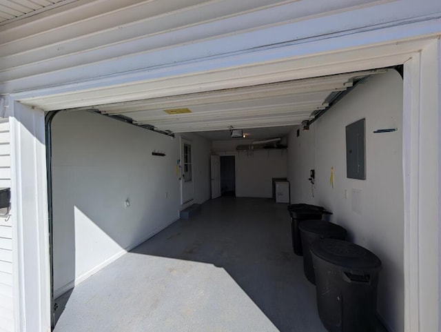 garage featuring electric panel and a garage door opener