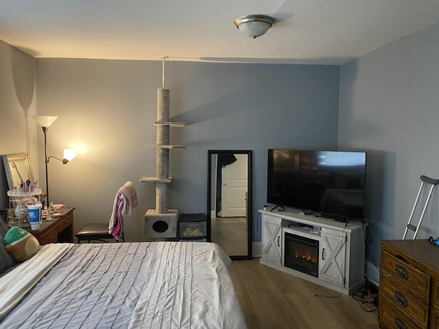 bedroom with wood finished floors