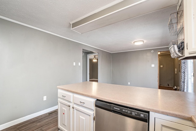 kitchen with stainless steel dishwasher, dark wood-style floors, white cabinetry, and a textured ceiling