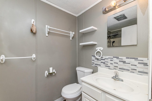 full bath featuring tasteful backsplash, crown molding, toilet, vanity, and a textured ceiling