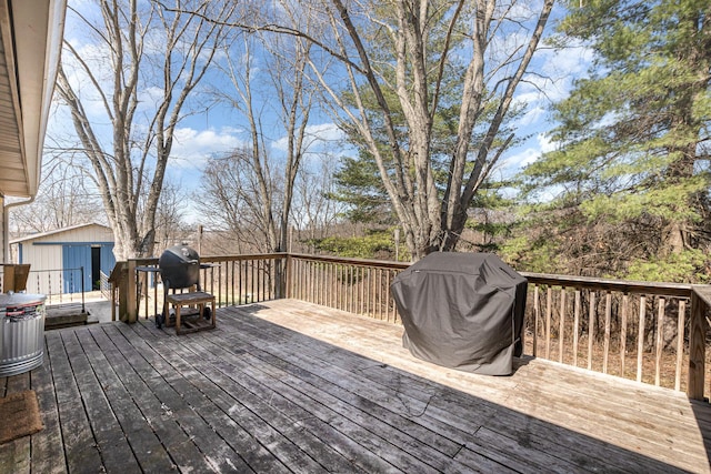 deck with an outbuilding and area for grilling