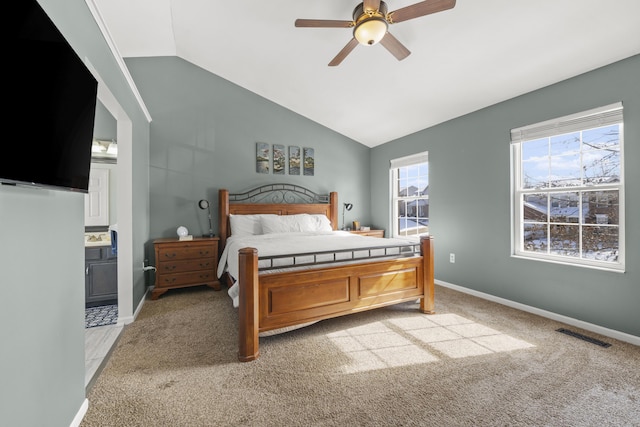 bedroom featuring lofted ceiling, baseboards, and visible vents