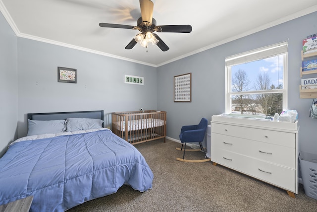 bedroom with carpet flooring, baseboards, crown molding, and ceiling fan