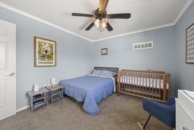 carpeted bedroom with baseboards, crown molding, and ceiling fan