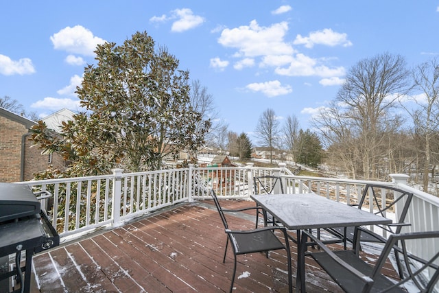 wooden deck featuring outdoor dining area and grilling area