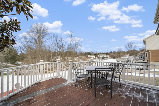 wooden deck with outdoor dining space