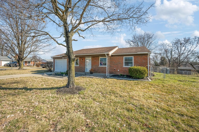 view of front of property with driveway, fence, a front yard, an attached garage, and brick siding