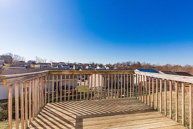 wooden deck with a residential view