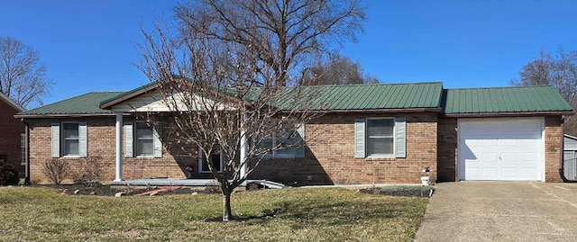 view of property exterior with a yard, metal roof, concrete driveway, a garage, and brick siding