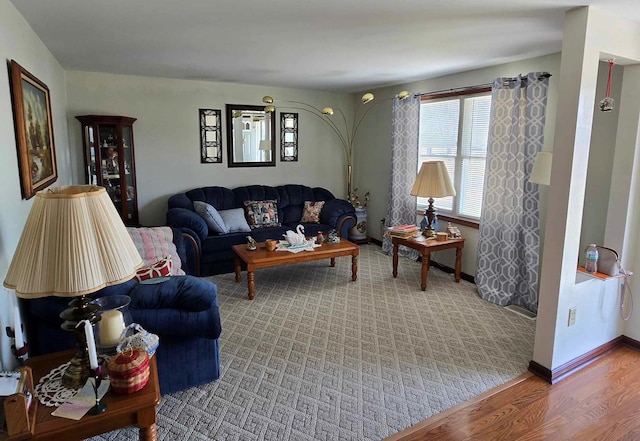 living room featuring baseboards and wood finished floors