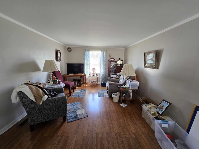 living room featuring baseboards, wood finished floors, and ornamental molding