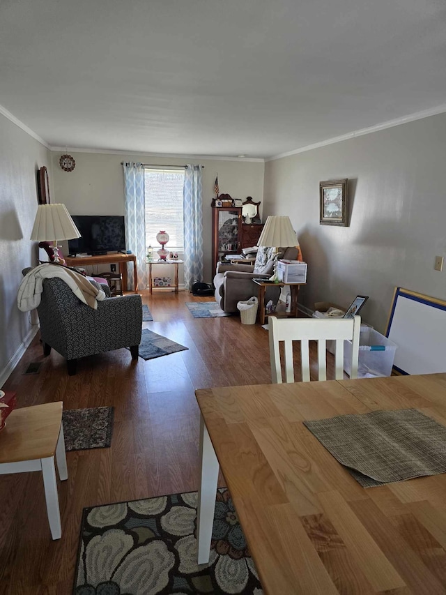 living room featuring wood finished floors and crown molding