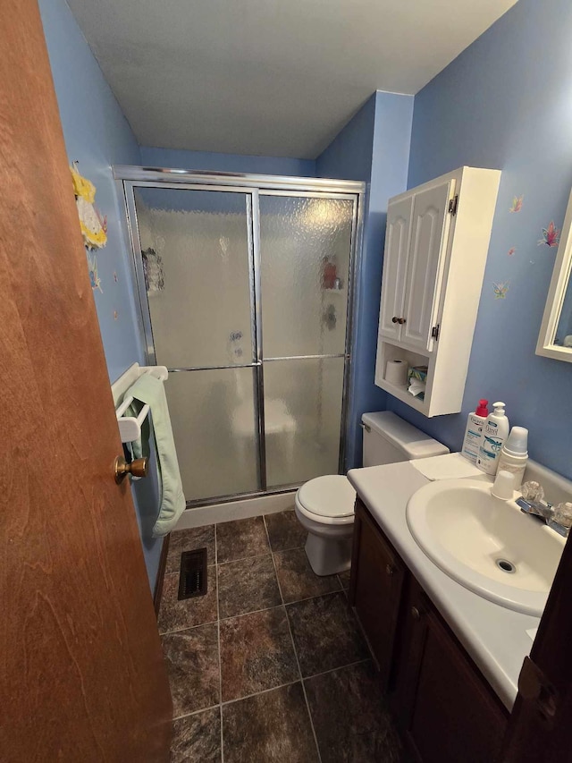 bathroom featuring visible vents, vanity, and a shower stall