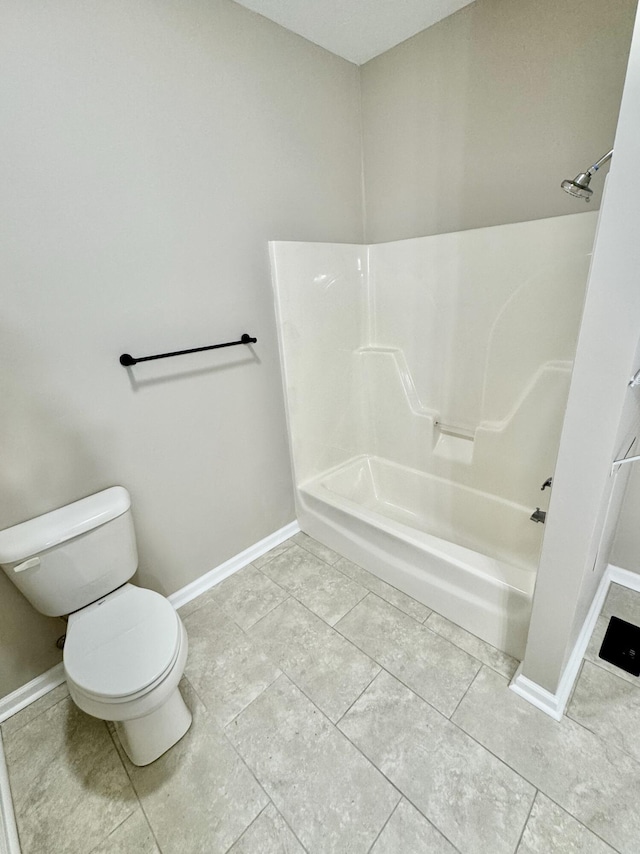 full bath featuring tile patterned flooring, toilet, baseboards, and shower / bath combination