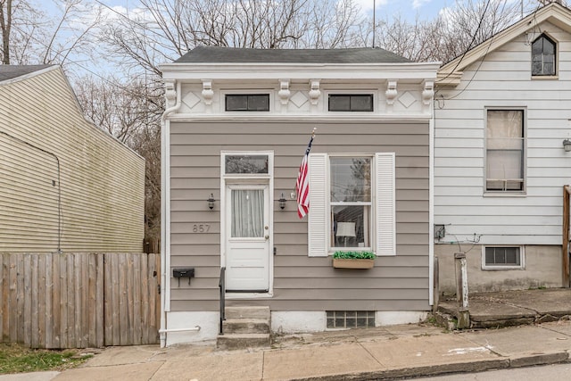 view of front of home with fence and entry steps