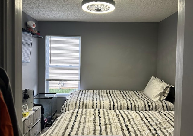 bedroom featuring a textured ceiling