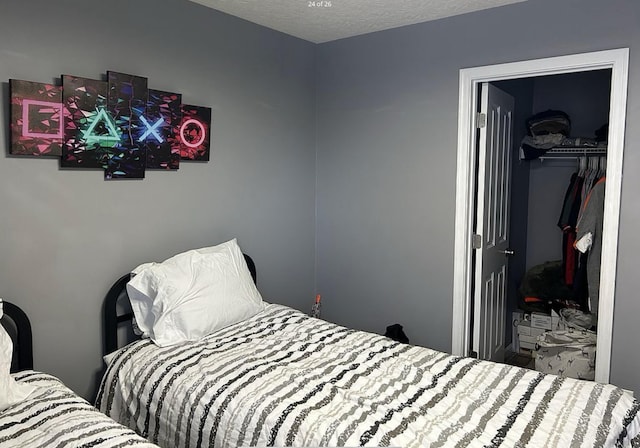 bedroom with a closet and a textured ceiling